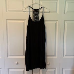 Black sheath dress with straps and a lace back panel